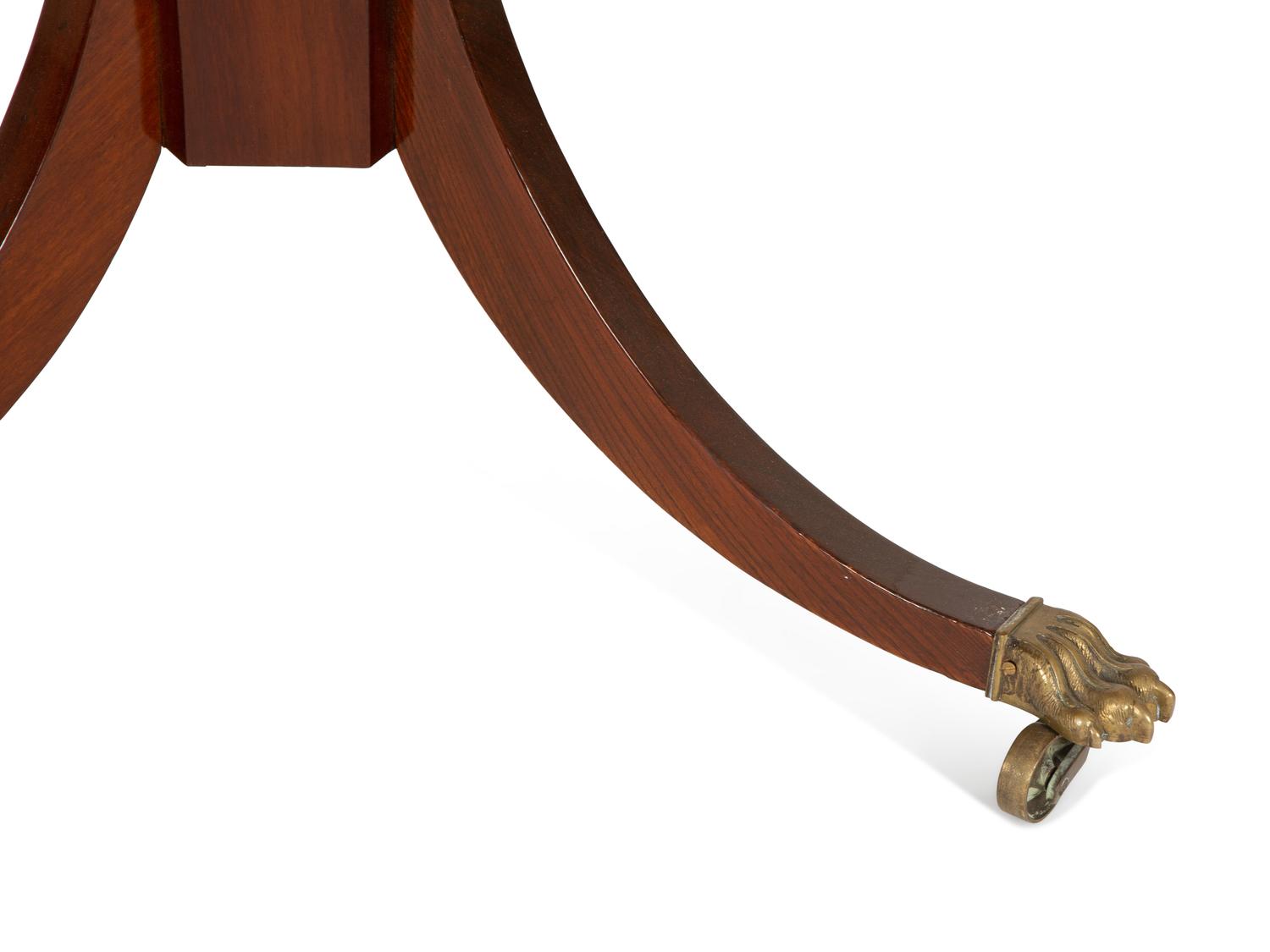A Regency Style Mahogany Center Table with Inset Brown Leather Top — 20th Century