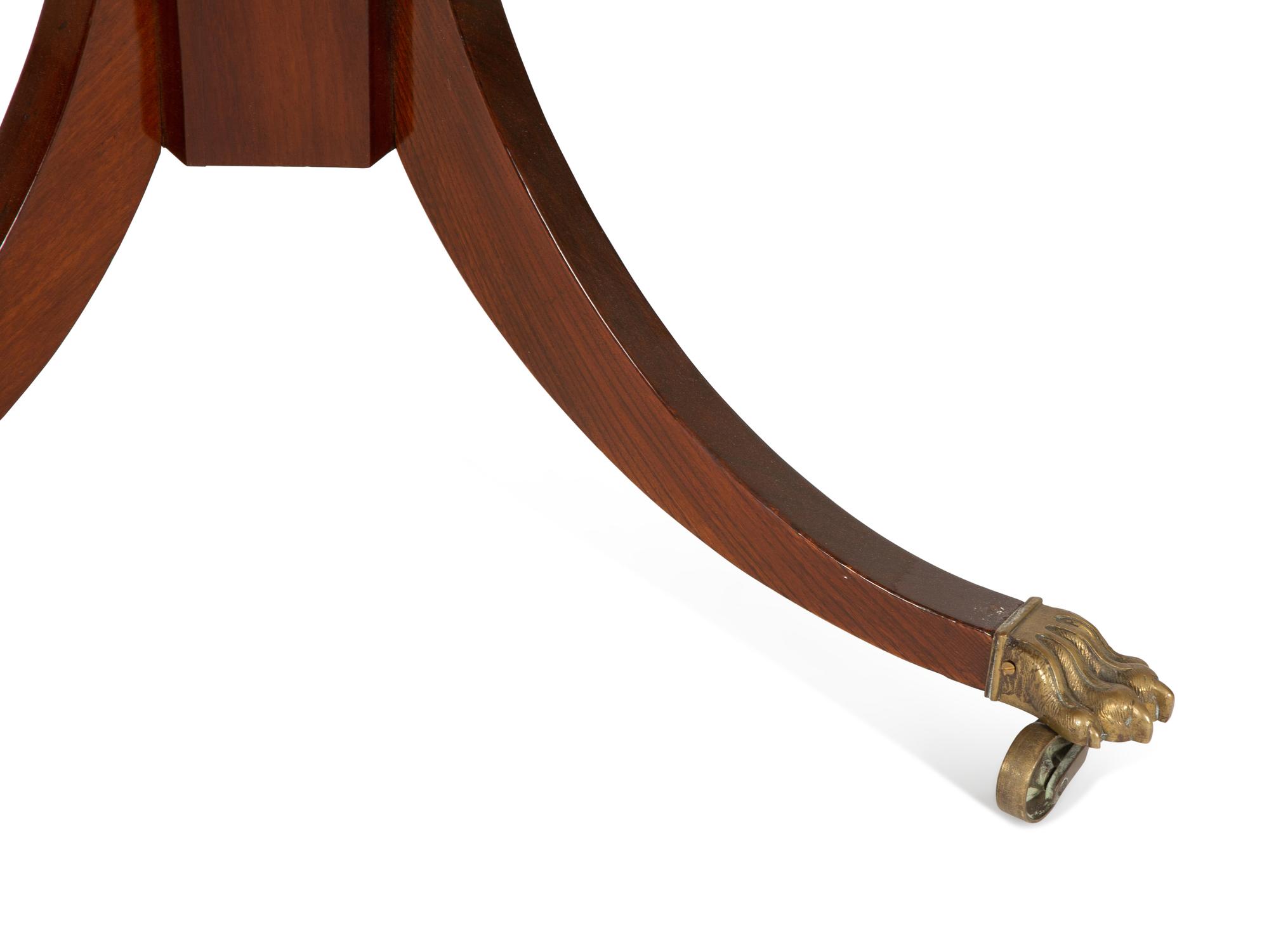 A Regency Style Mahogany Center Table with Inset Brown Leather Top — 20th Century