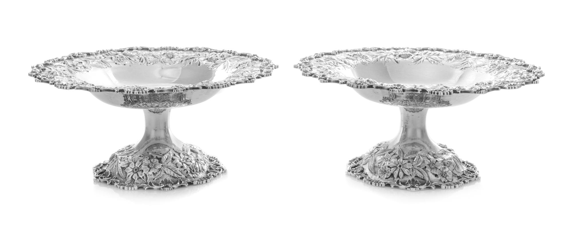 A Pair of American Silver Compotes, A.G. Schultz, Baltimore, MD, each having a repousse floral and foliate border, raised on a conformi