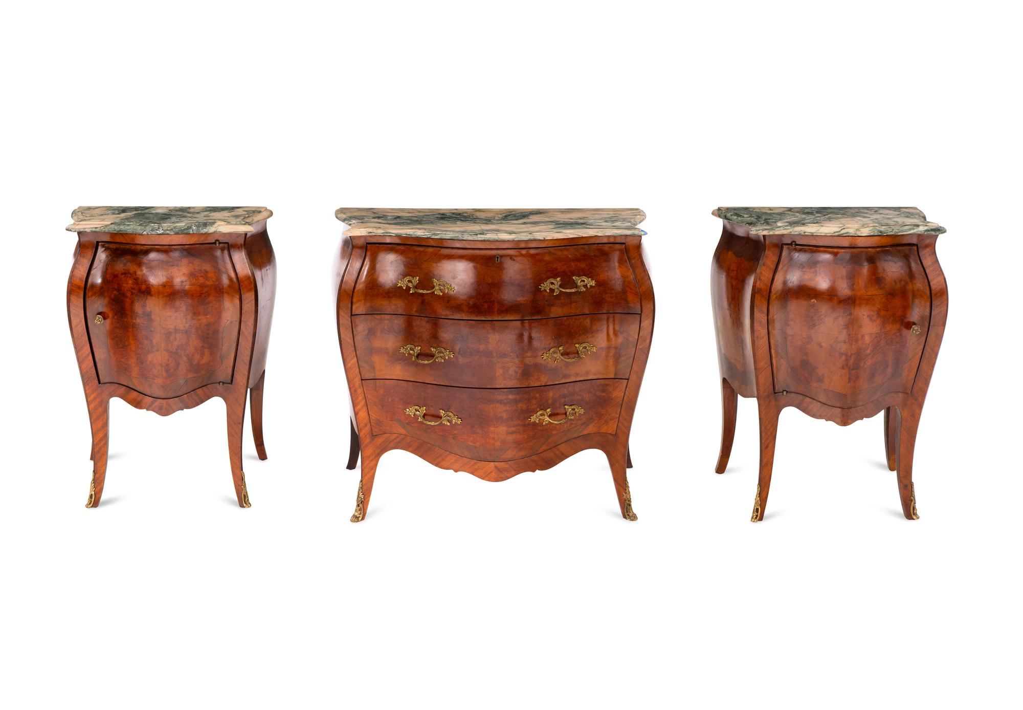 An Italian Bombe-Form Burled Walnut Three-Piece Bedroom Suite with Marble Tops