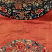 A Chinese Apricot Ground Embroidered 'Peony and Butterfly' Silk Semi-Informal Lady's Robe, Jifupao, late 18th/19th Century 清中期 杏子緞繡八團蝶戀花吉服袍