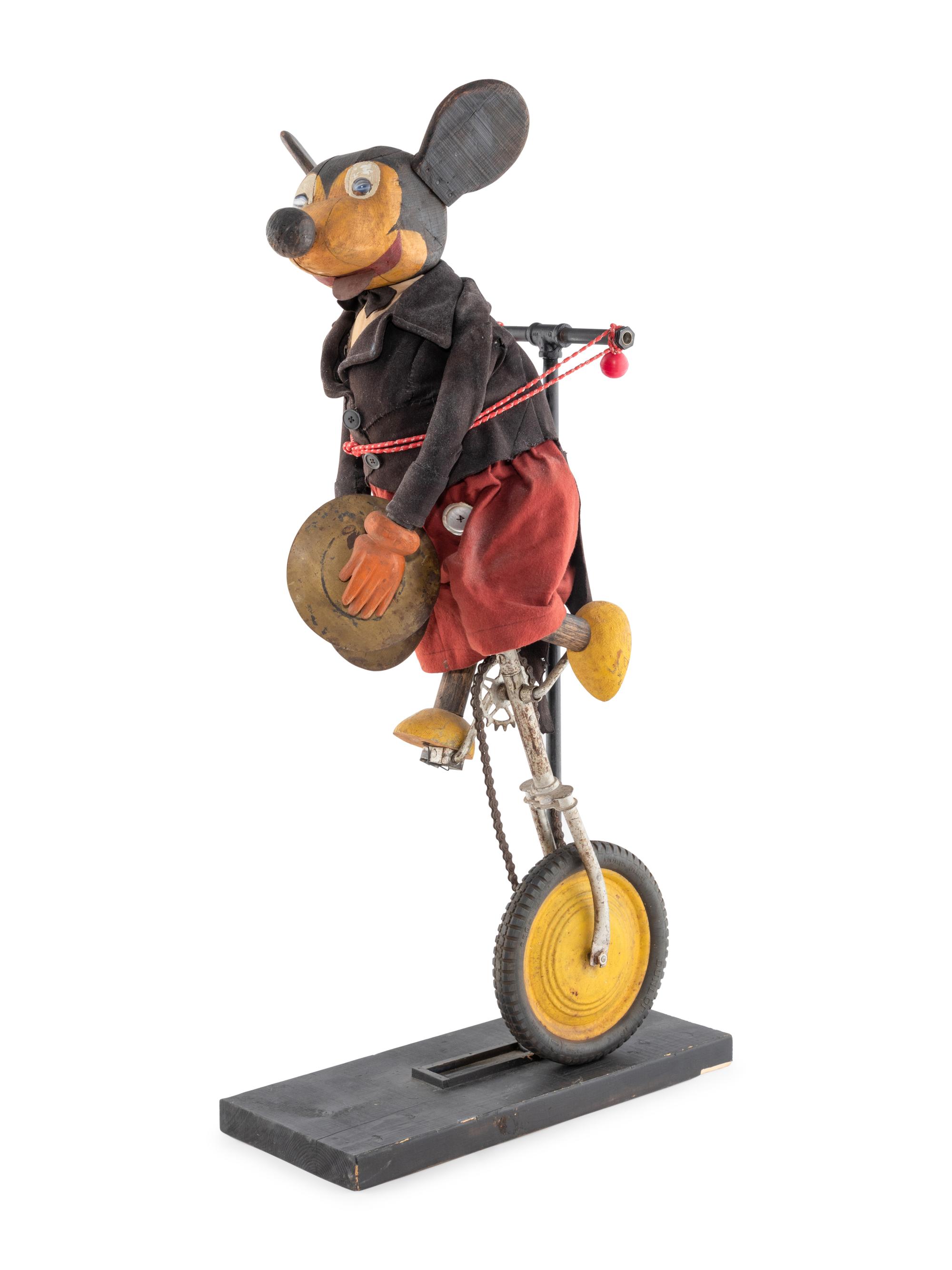 A Carved and Painted Folk Art Mickey Mouse Toy