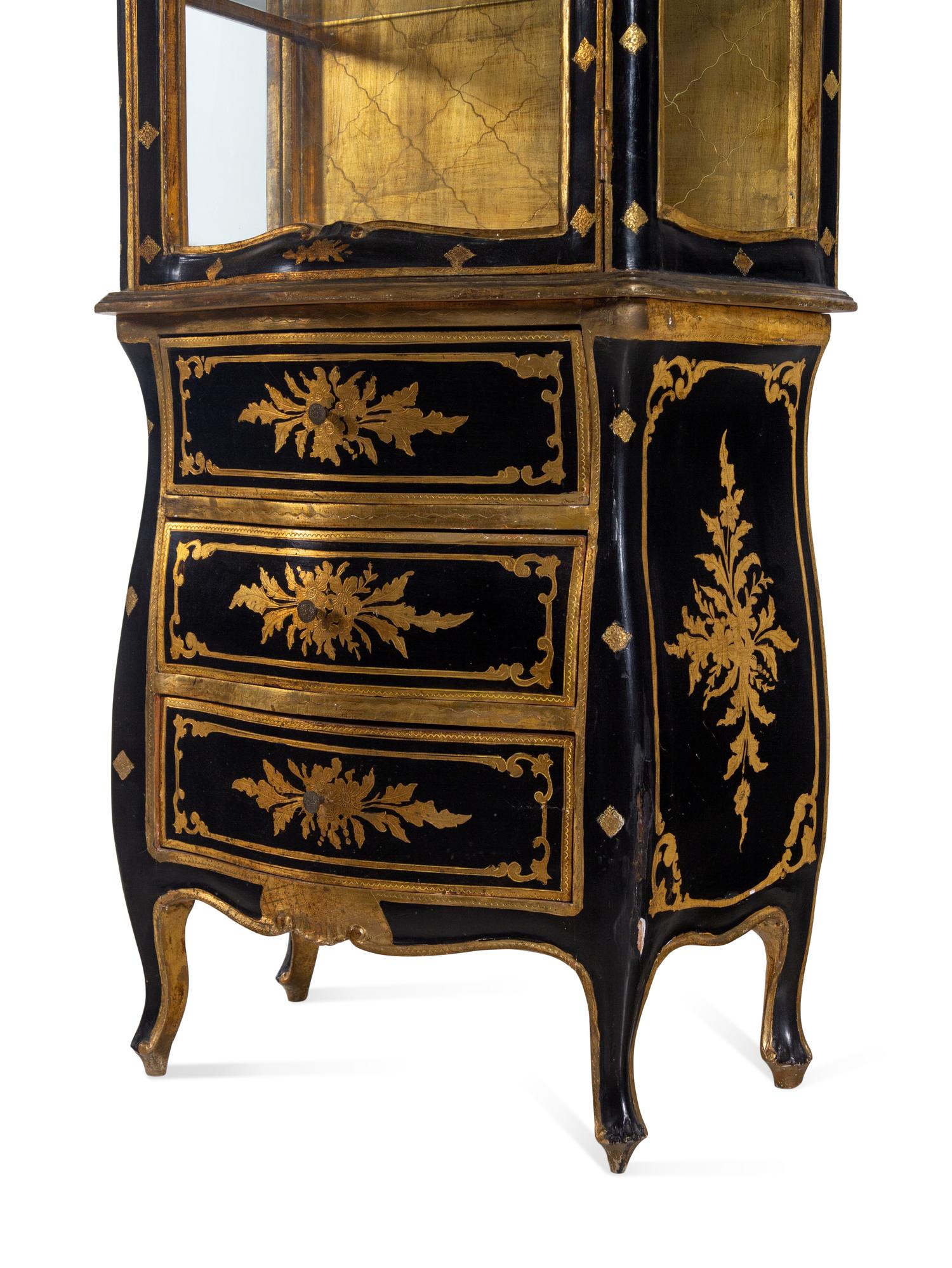 An Italian Parcel Gilt Ebonized Vitrine Cabinet