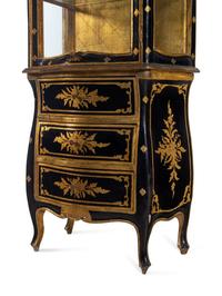 An Italian Parcel Gilt Ebonized Vitrine Cabinet