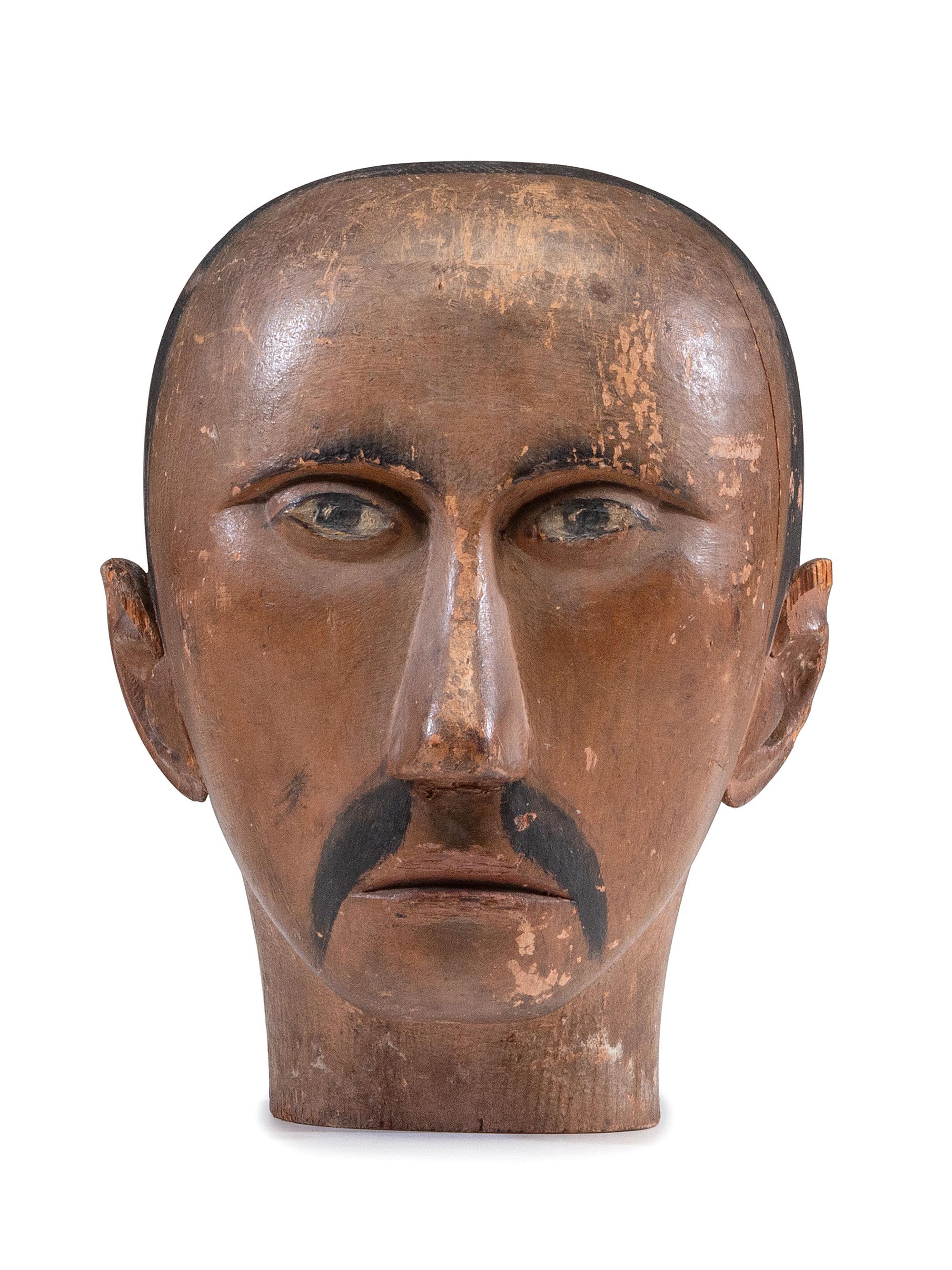 A Folk Art Carved and Painted Pine Carnival Head
