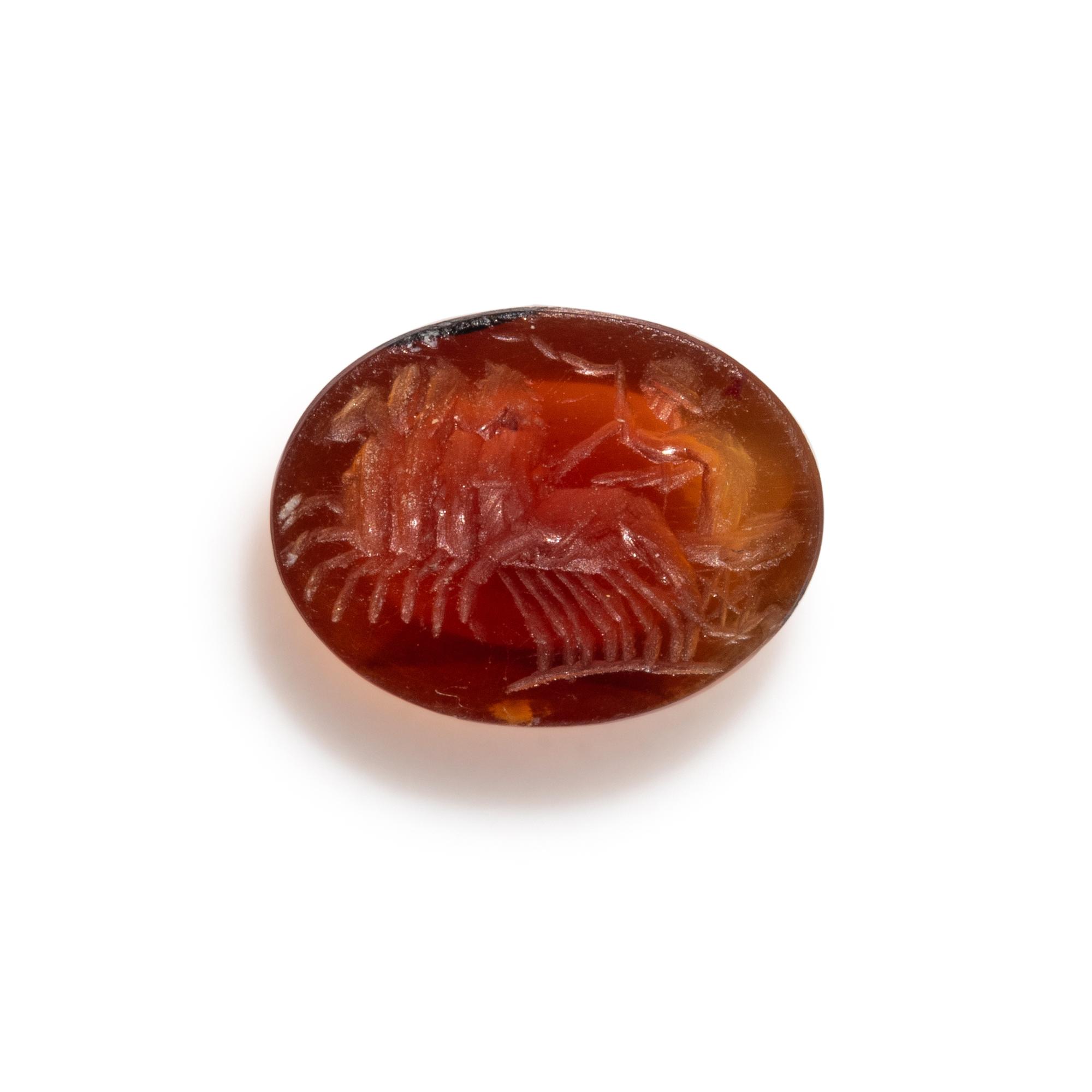 A Roman Carnelian Ring Stone with a Quadriga Chariot and Driver