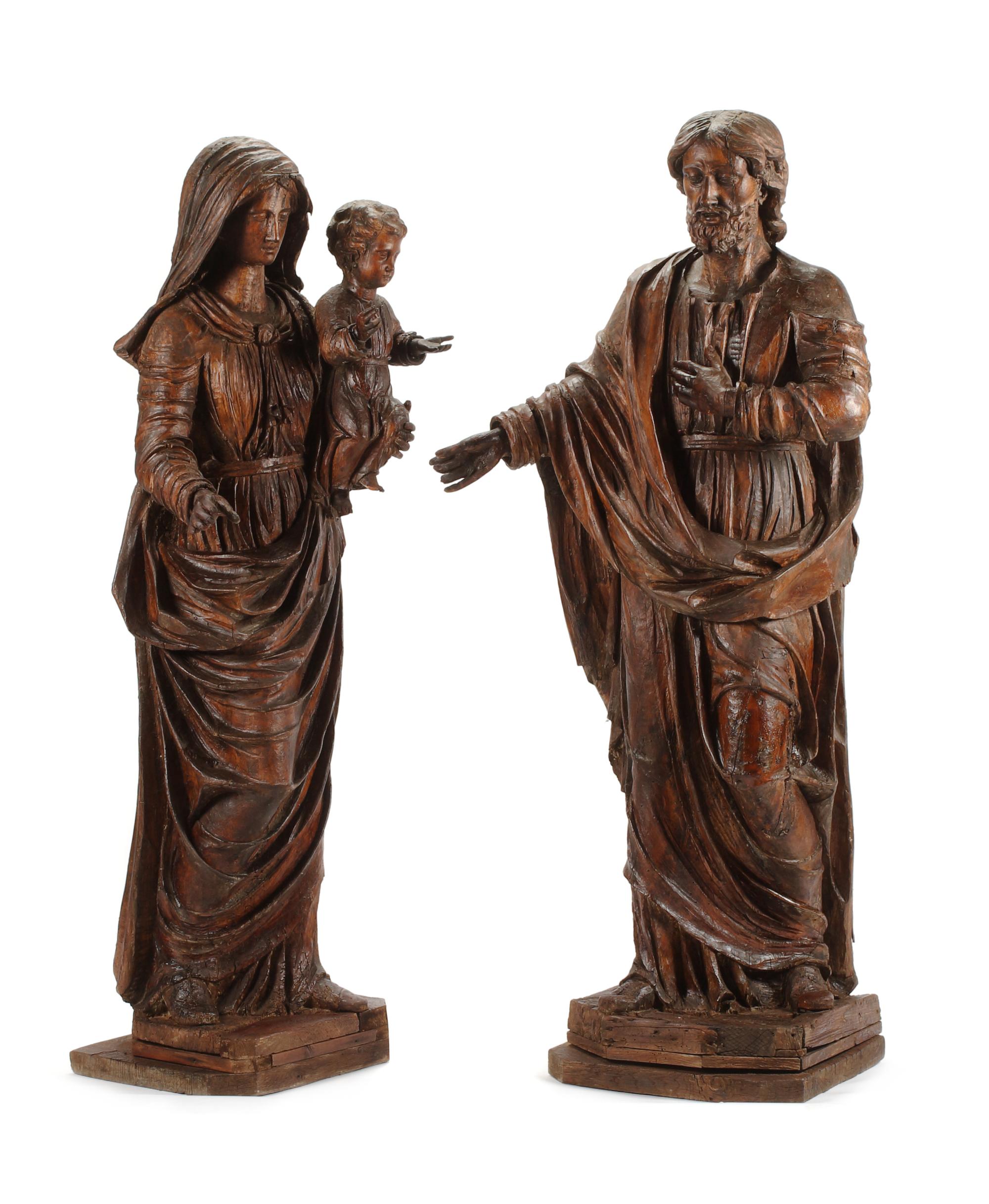 A Pair of French Carved Walnut Figures Height 67 inches. — 17TH CENTURY