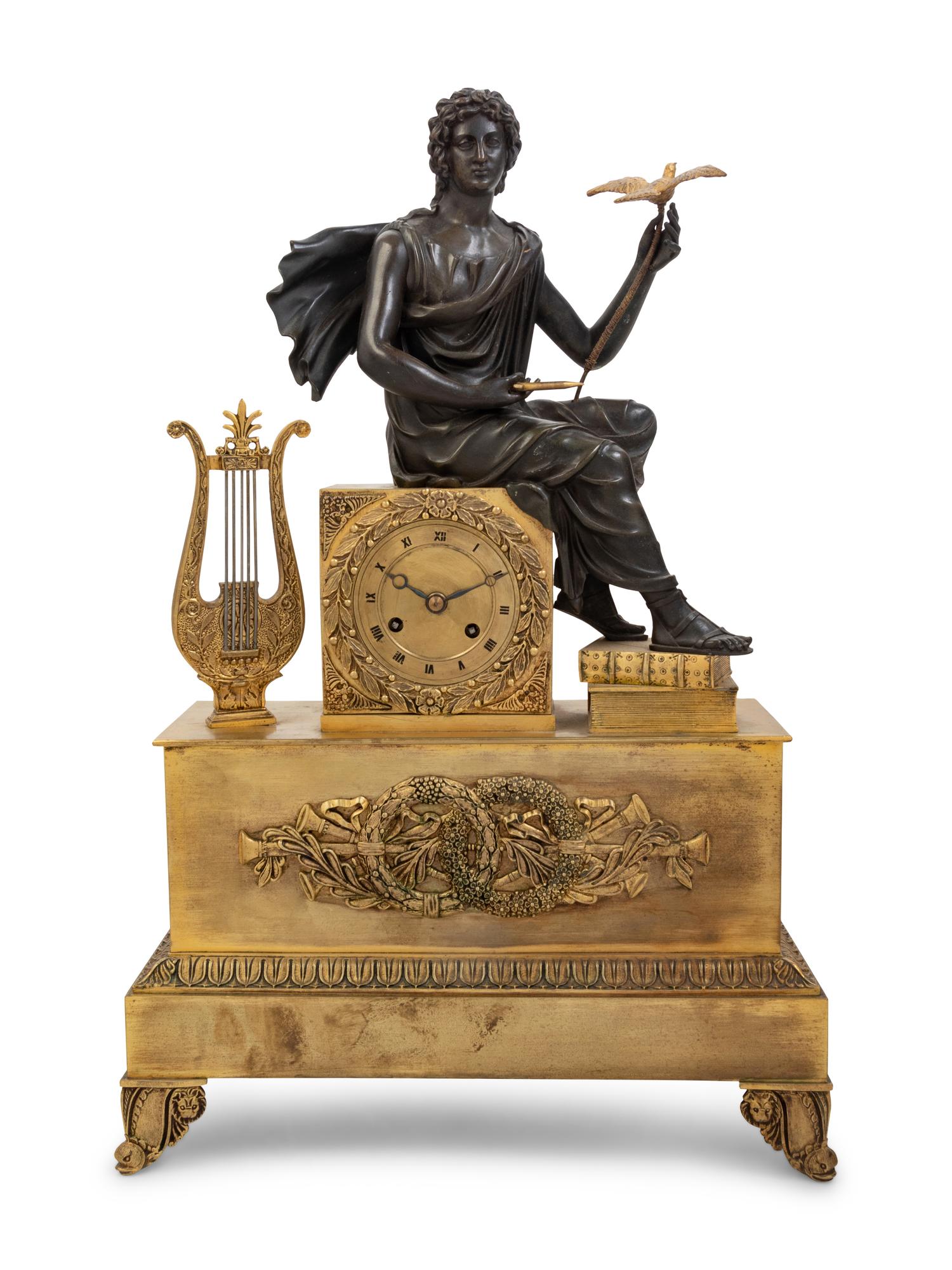 An Empire Style Gilt and Patinated Bronze Figural Mantel Clock