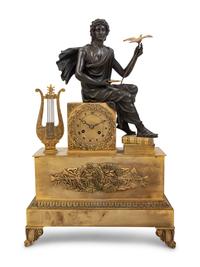 An Empire Style Gilt and Patinated Bronze Figural Mantel Clock