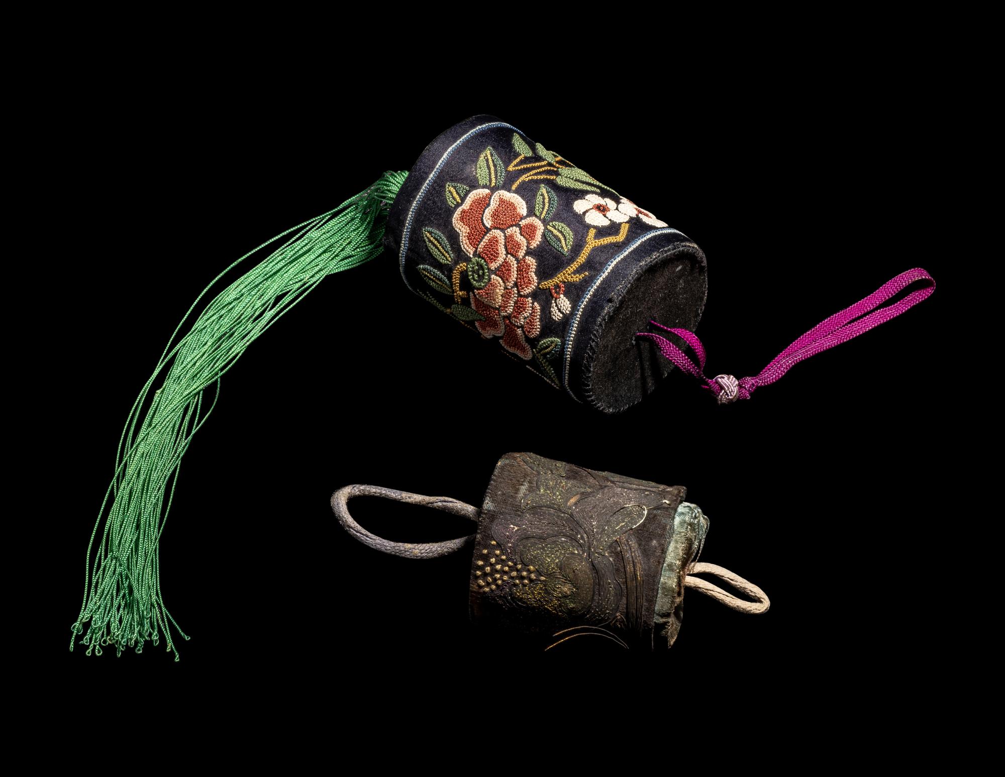 A Group of Chinese Jade and Hardstone Archers Rings with an Embroidered Silk Case