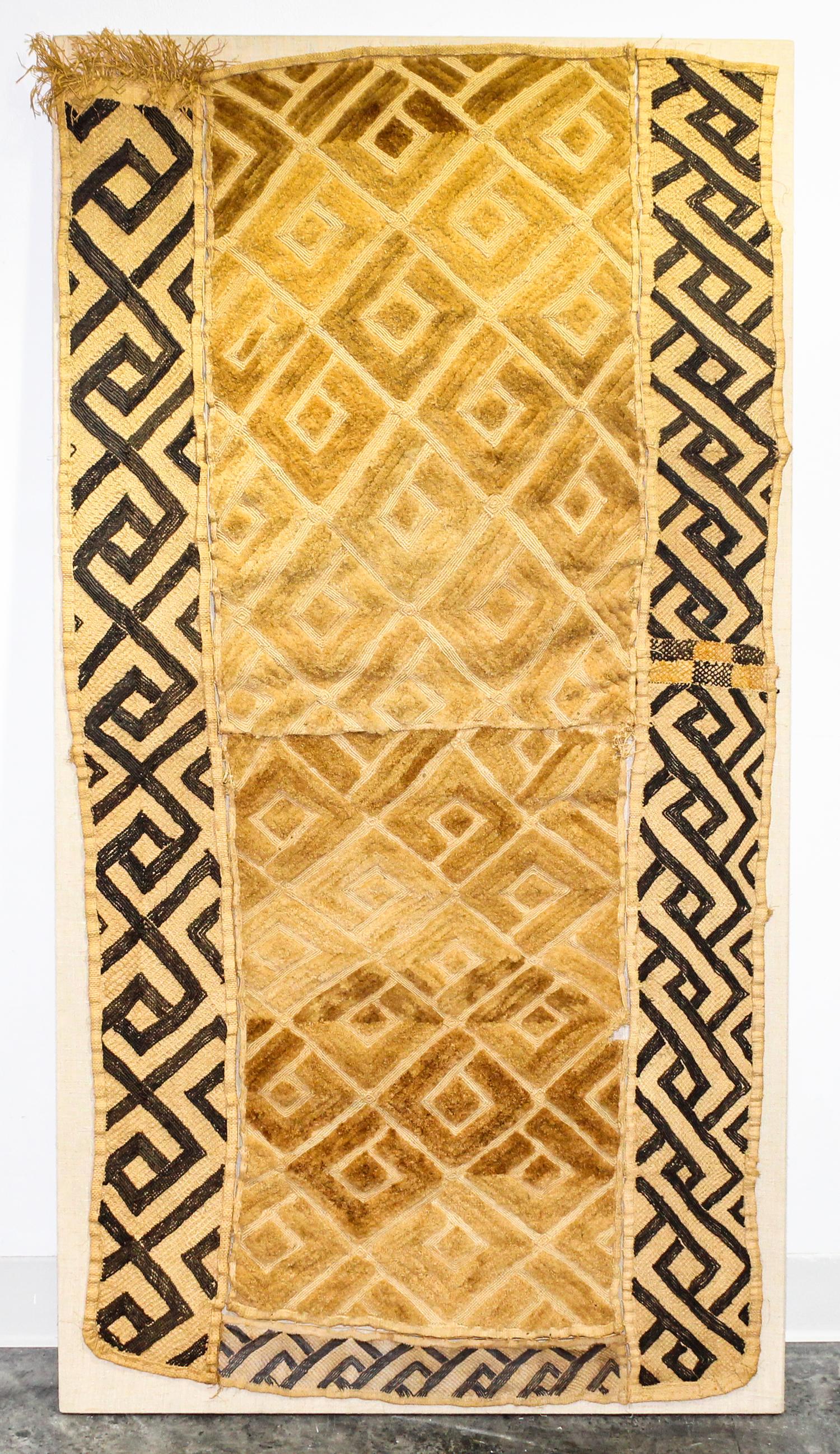 A Kuba Cloth Length 56 1/4 x width 27 1/2 inches.