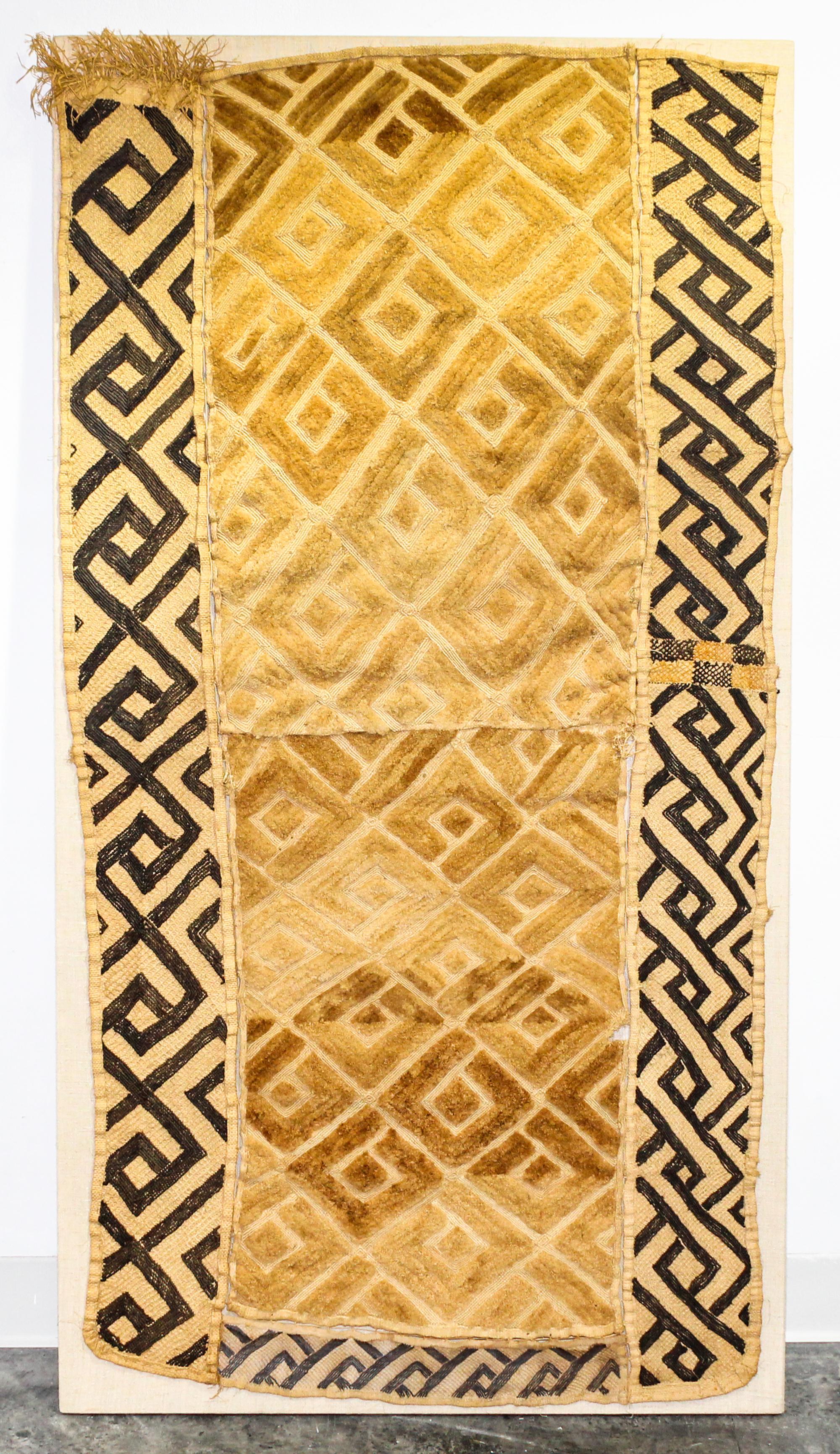 A Kuba Cloth Length 56 1/4 x width 27 1/2 inches.