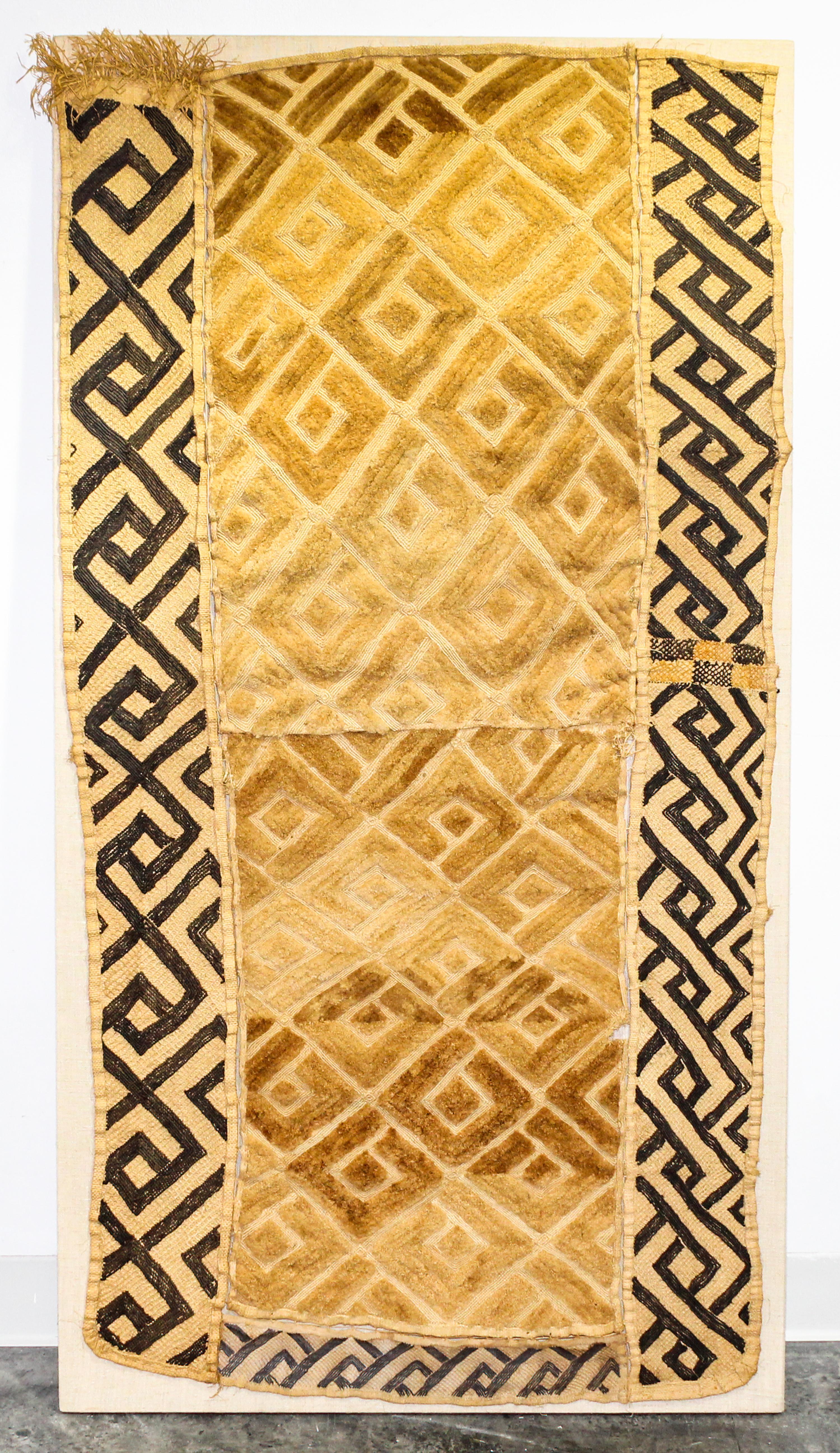 A Kuba Cloth Length 56 1/4 x width 27 1/2 inches.