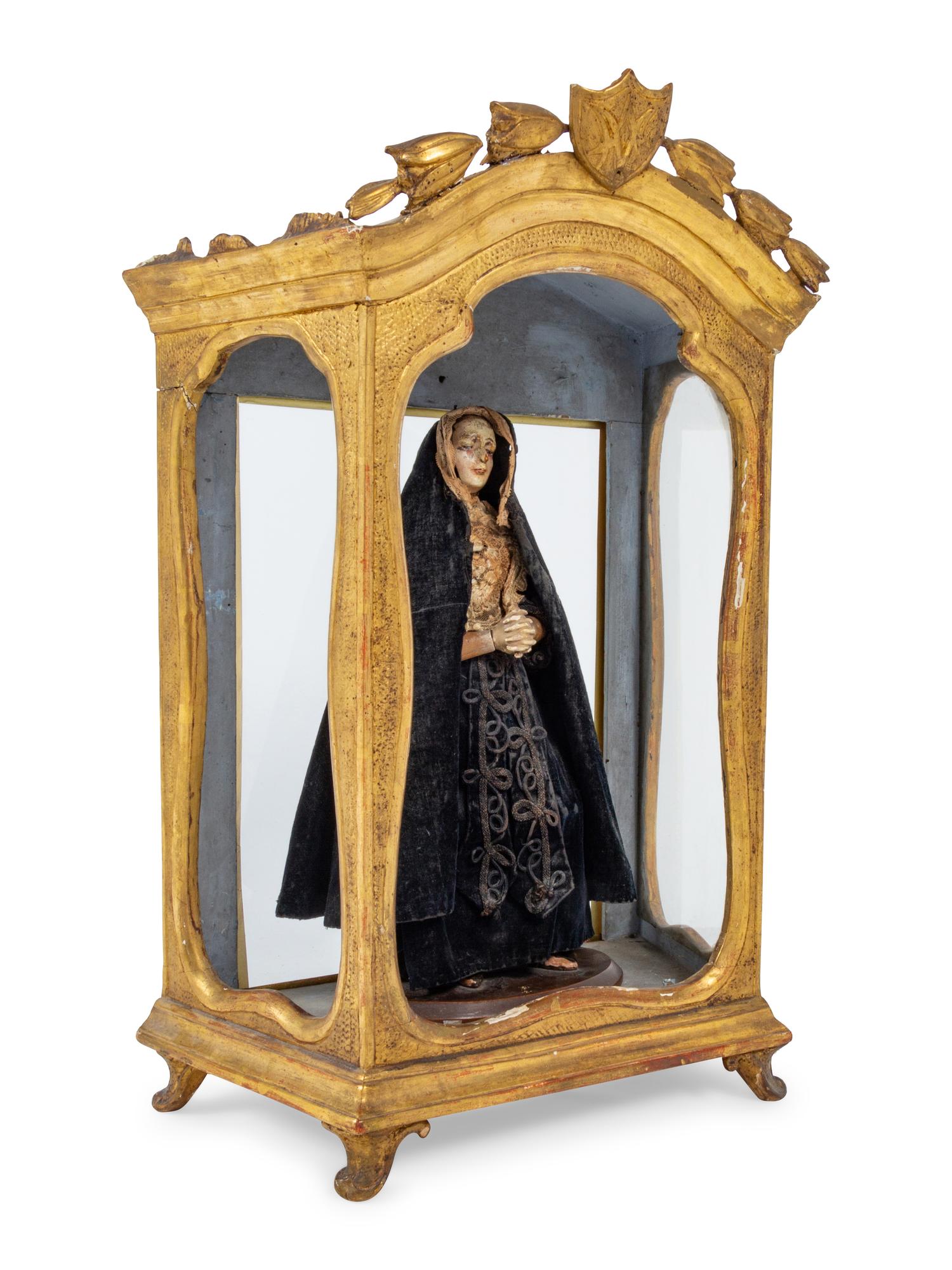 A Continental Giltwood Reliquary with a Painted Figure of a Saint
