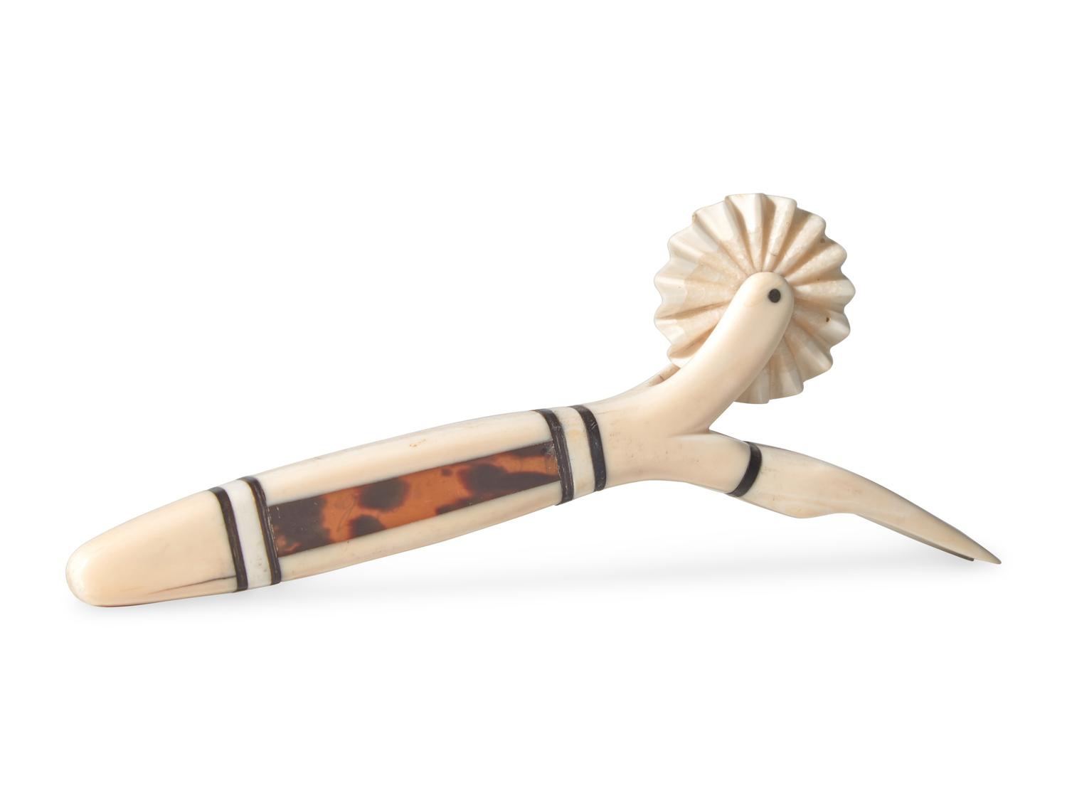A Scrimshaw Carved Whale Tooth Pie Crimper and Fork, 19th Century