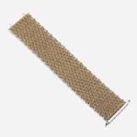 A bicolor fourteen karat gold and diamond bracelet