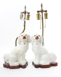 A Pair of Staffordshire Spaniels Height 12 inches. — 19TH CENTURY