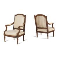 A Pair of Louis XVI Style Walnut Fauteuils