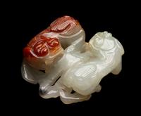 A Chinese Russet and Pale Celadon Jadeite Carving