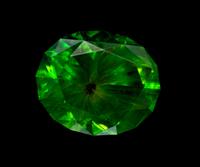 A 4.24 Carat Oval Mixed Cut Russian Demantoid Garnet,