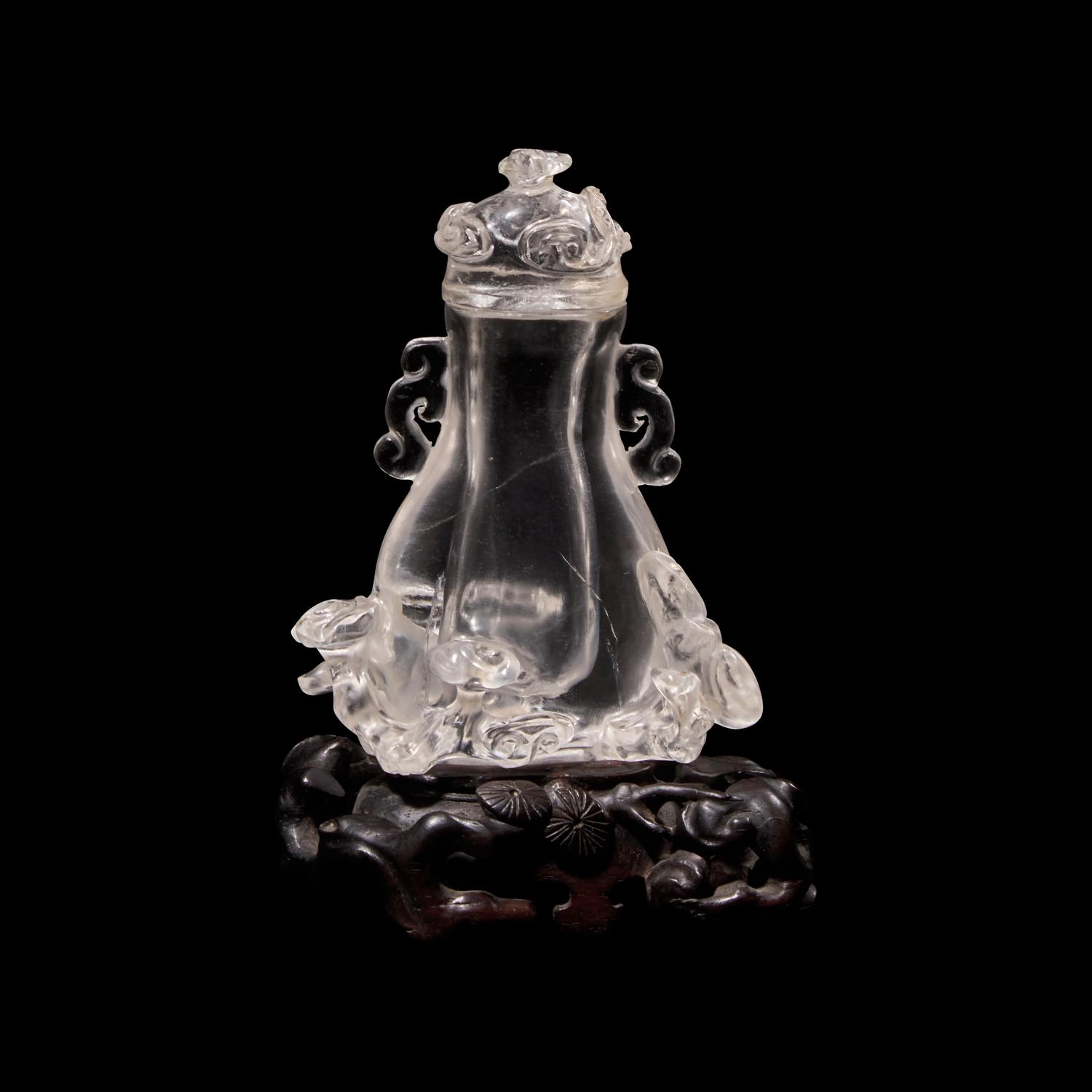 A Small Chinese Rock Crystal Vase and Cover with Wood Stand, Qing Dynasty 清 水晶靈芝紋小蓋瓶