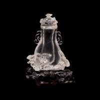 A Small Chinese Rock Crystal Vase and Cover with Wood Stand, Qing Dynasty 清 水晶靈芝紋小蓋瓶