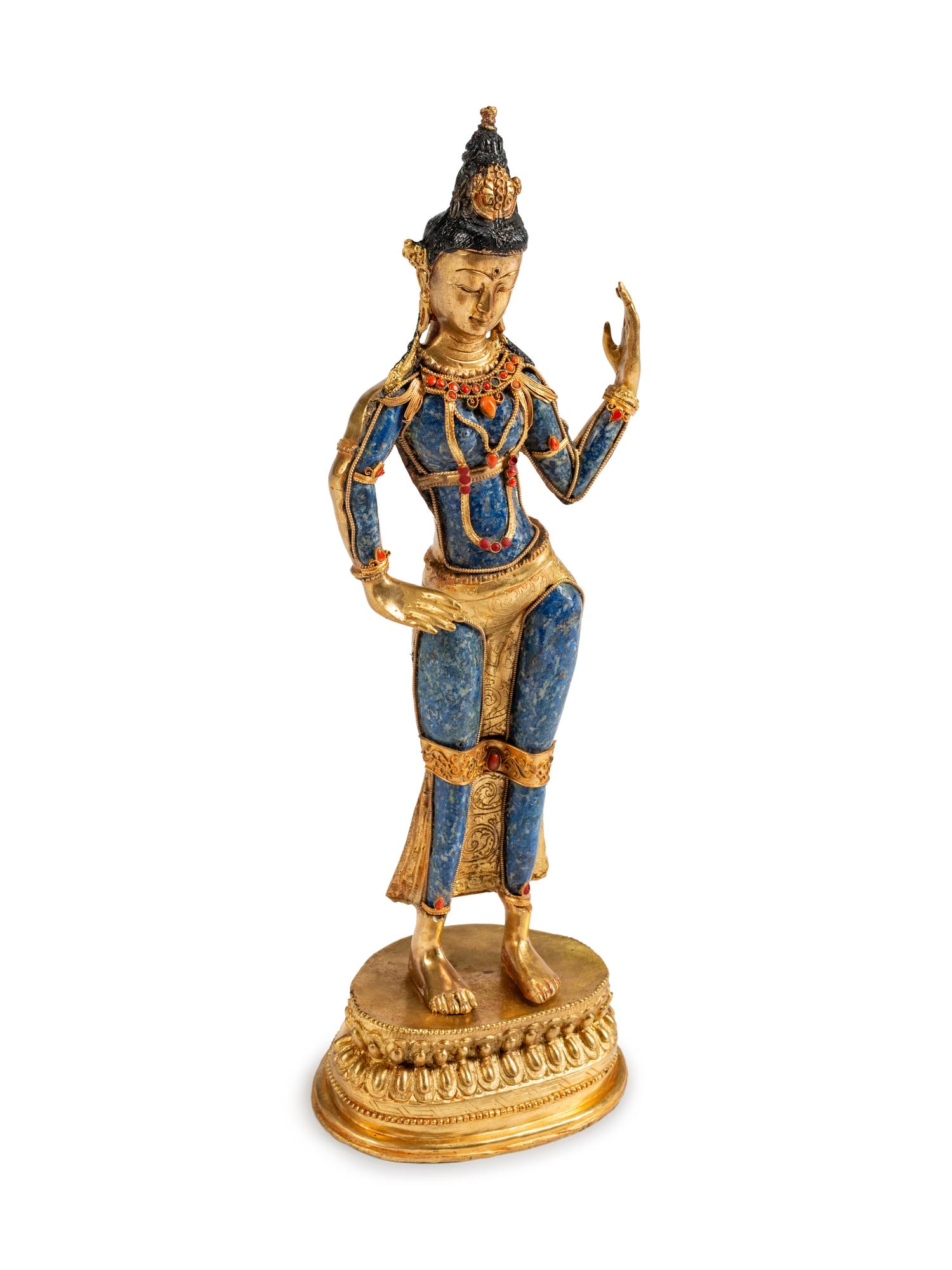 A Tibetan Jeweled Bronze and Sodalite Figure of a Deity