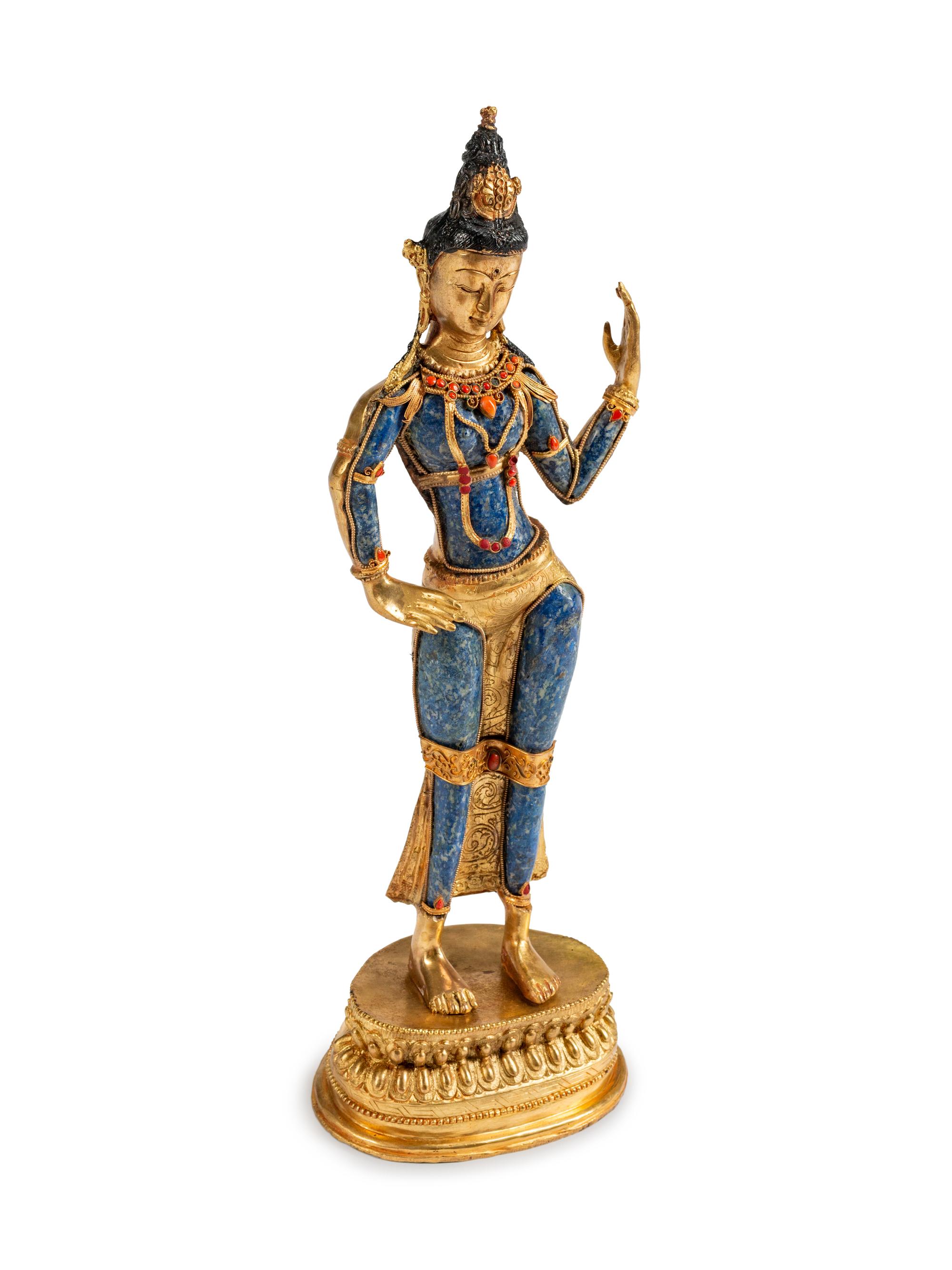 A Tibetan Jeweled Bronze and Sodalite Figure of a Deity