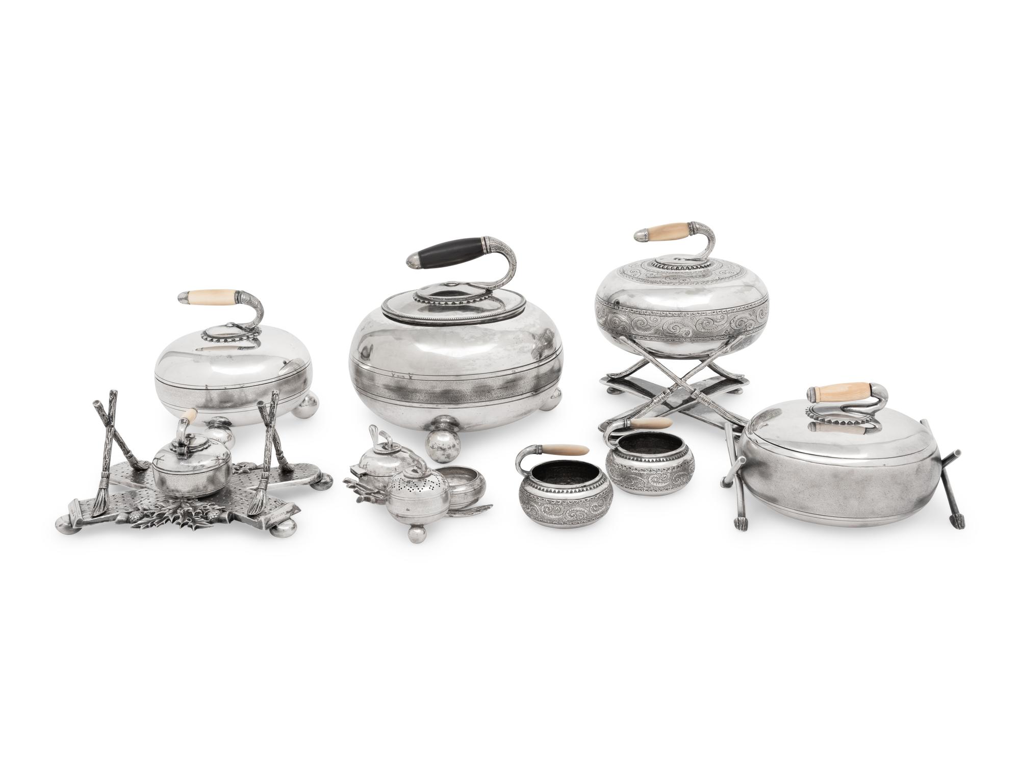 A Group of Eight Curling Stone-Form Silver-Plate Table Articles