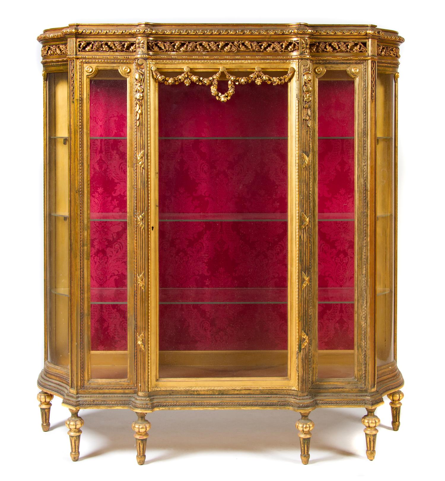A Louis XVI Style Giltwood Vitrine Cabinet Height 62 1/2 x width 56 1/2 x depth 16 inches. — EARLY 20TH CENTURY