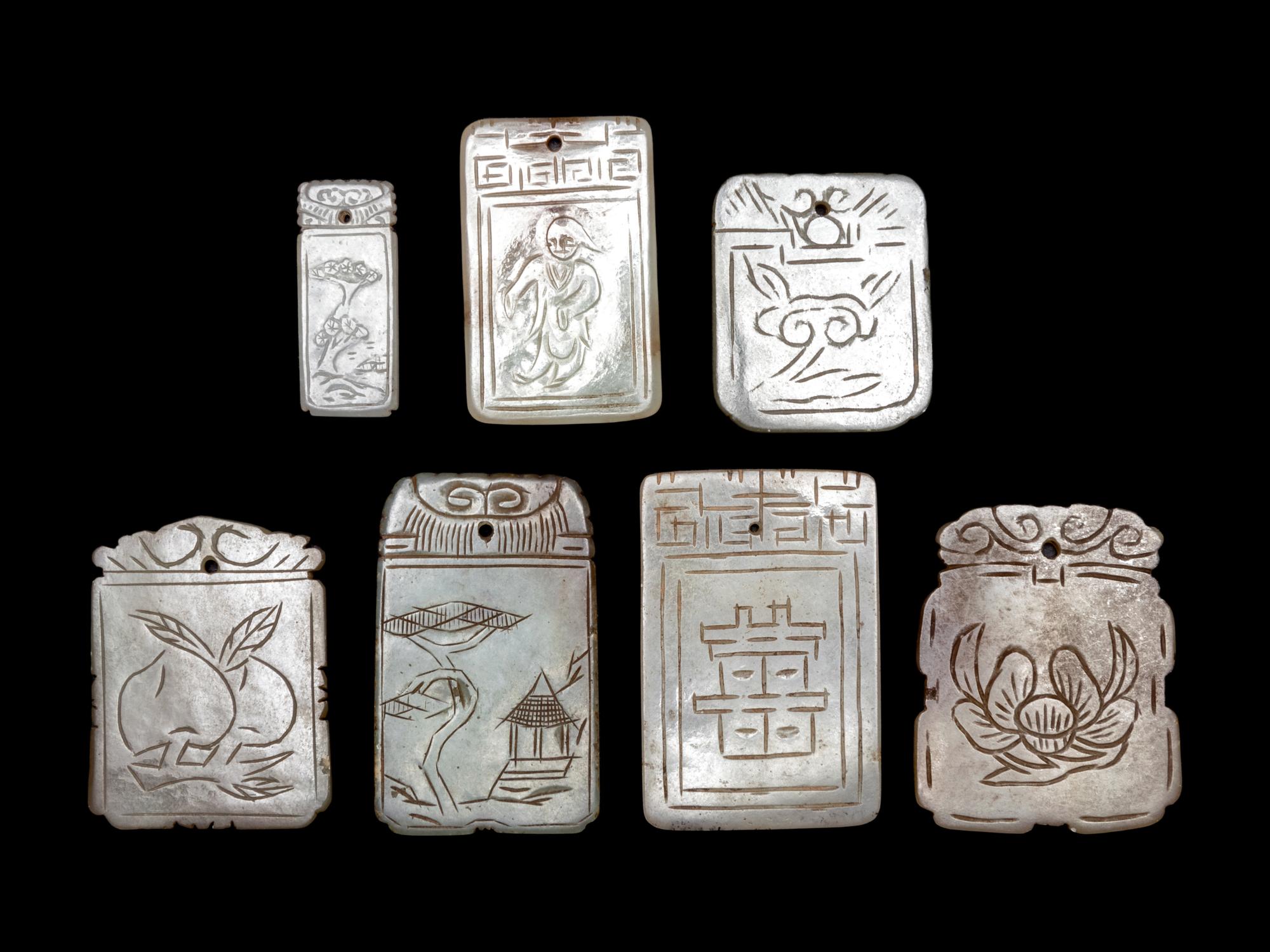 Seven Chinese Pale Celadon Jade Carved Plaques