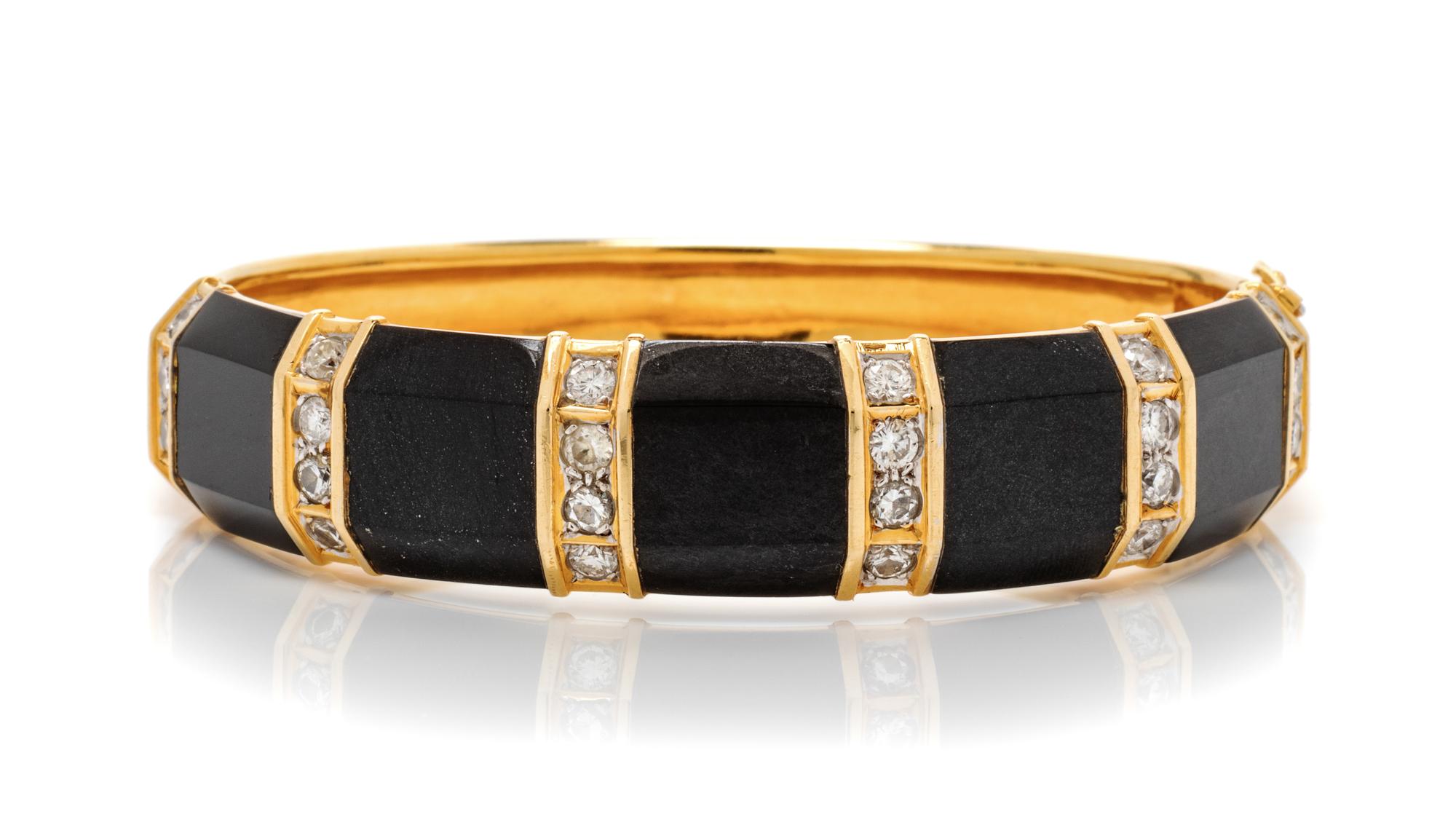 An 18 Karat Yellow Gold, Diamond and Onyx Bangle Bracelet, 35.10 dwts.