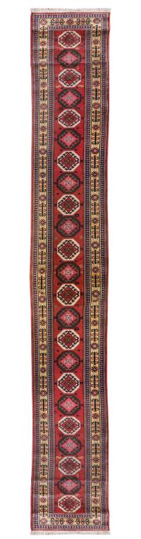 A Caucasian Wool Runner 20 feet 3/4 inches x 2 feet 7 inches.