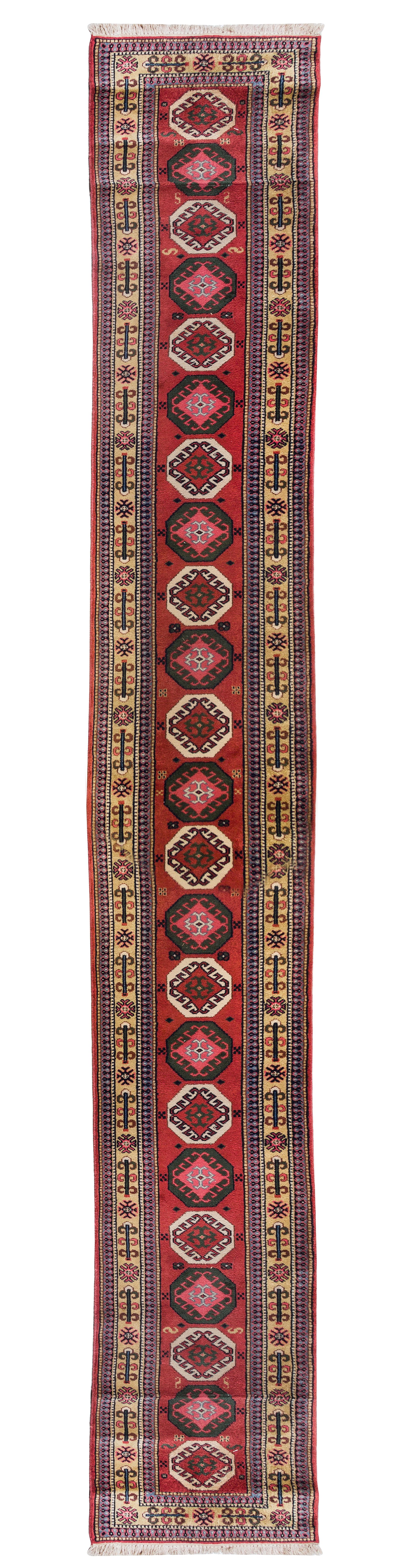 A Caucasian Wool Runner 20 feet 3/4 inches x 2 feet 7 inches.