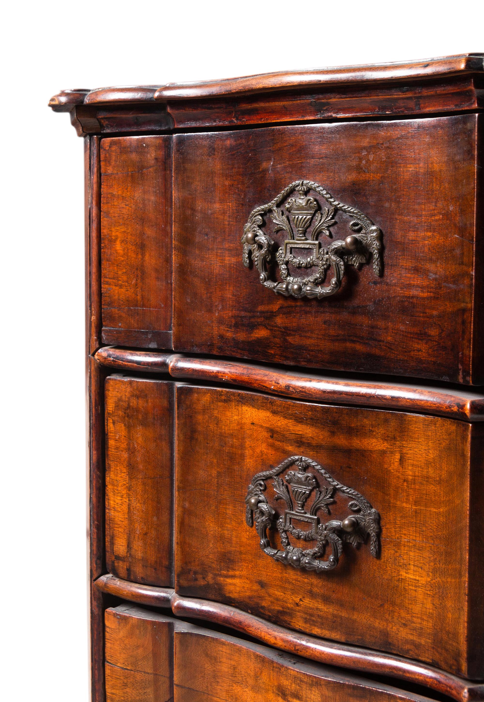 A Dutch Walnut Serpentine-Front Chest of Drawers