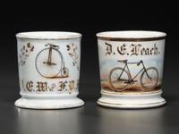 Two Cyclist's Porcelain Shaving Mugs