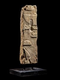 An Egyptian Limestone Relief Fragment with a Pharaoh