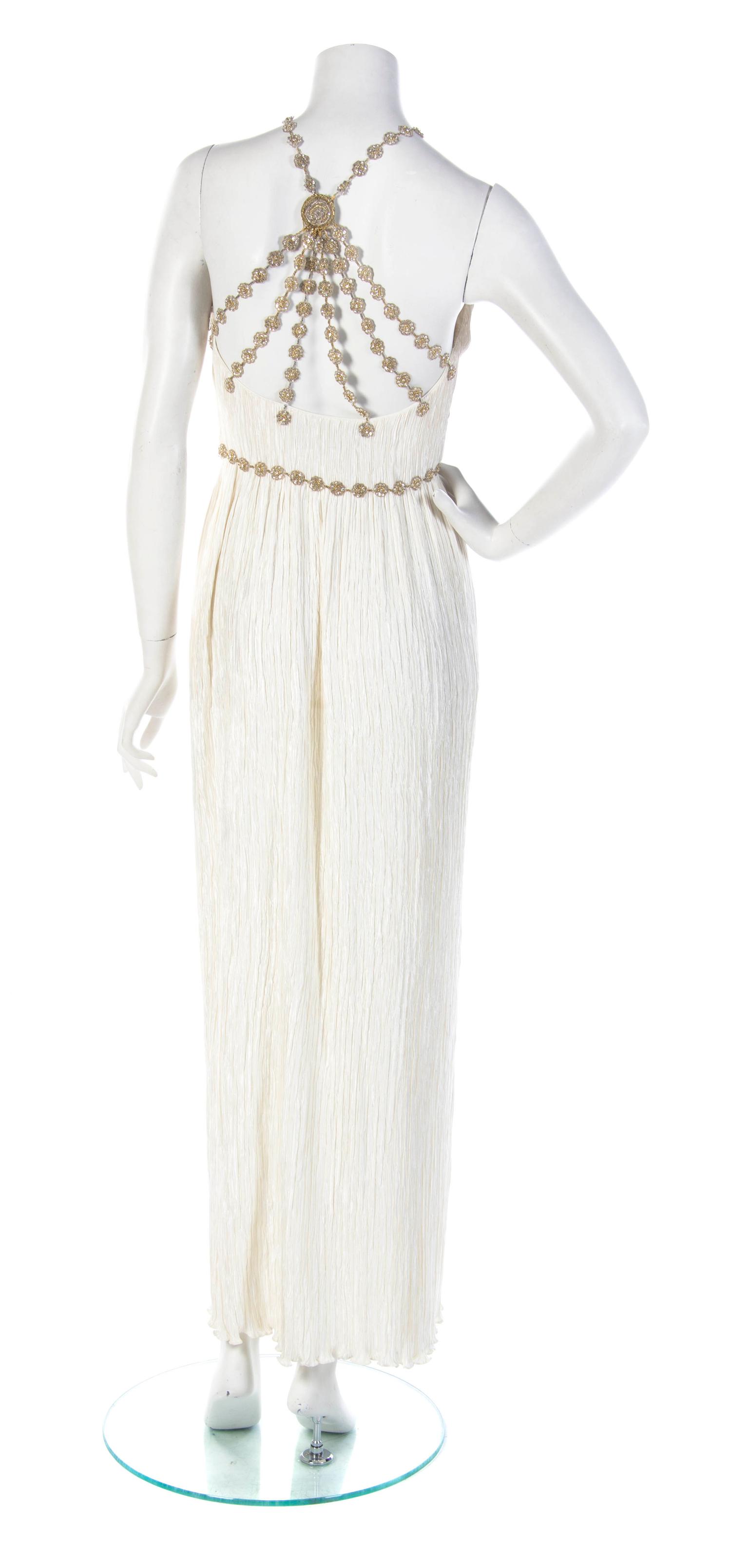 A Mary McFadden Couture Ivory Pleated Halter Gown, Size 6.