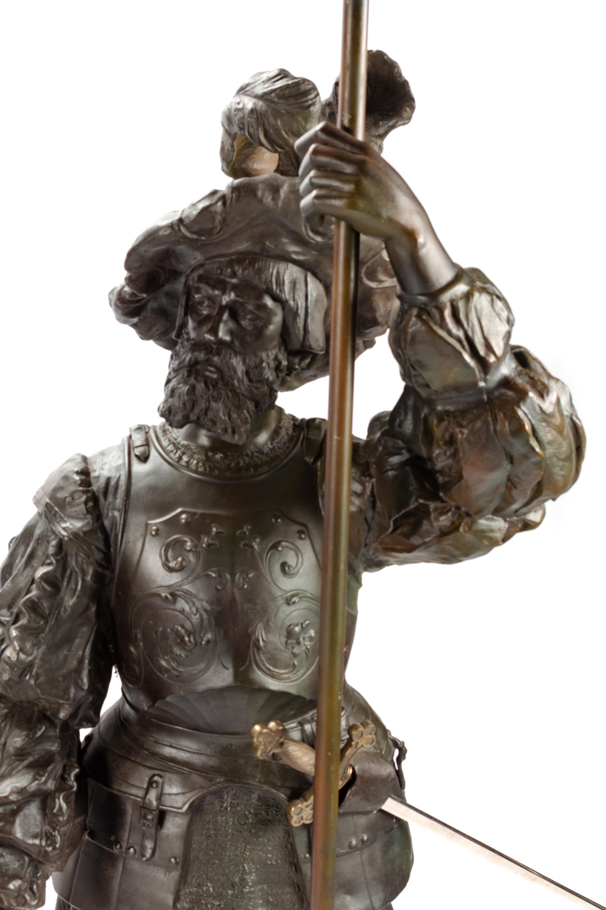 A Pair of Cast Metal Figural Torchères