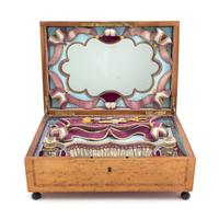 A Continental Mother-of-Pearl and Brass Inlaid Various Woods Musical Dresser Box, Width 13 1/2 inches.