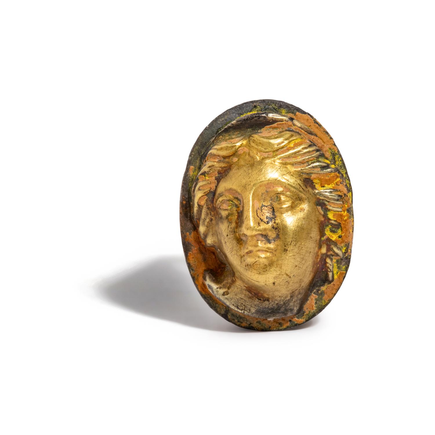 A Greek Gilt-Silver Finger Ring with a Female Portrait Head in High Relief