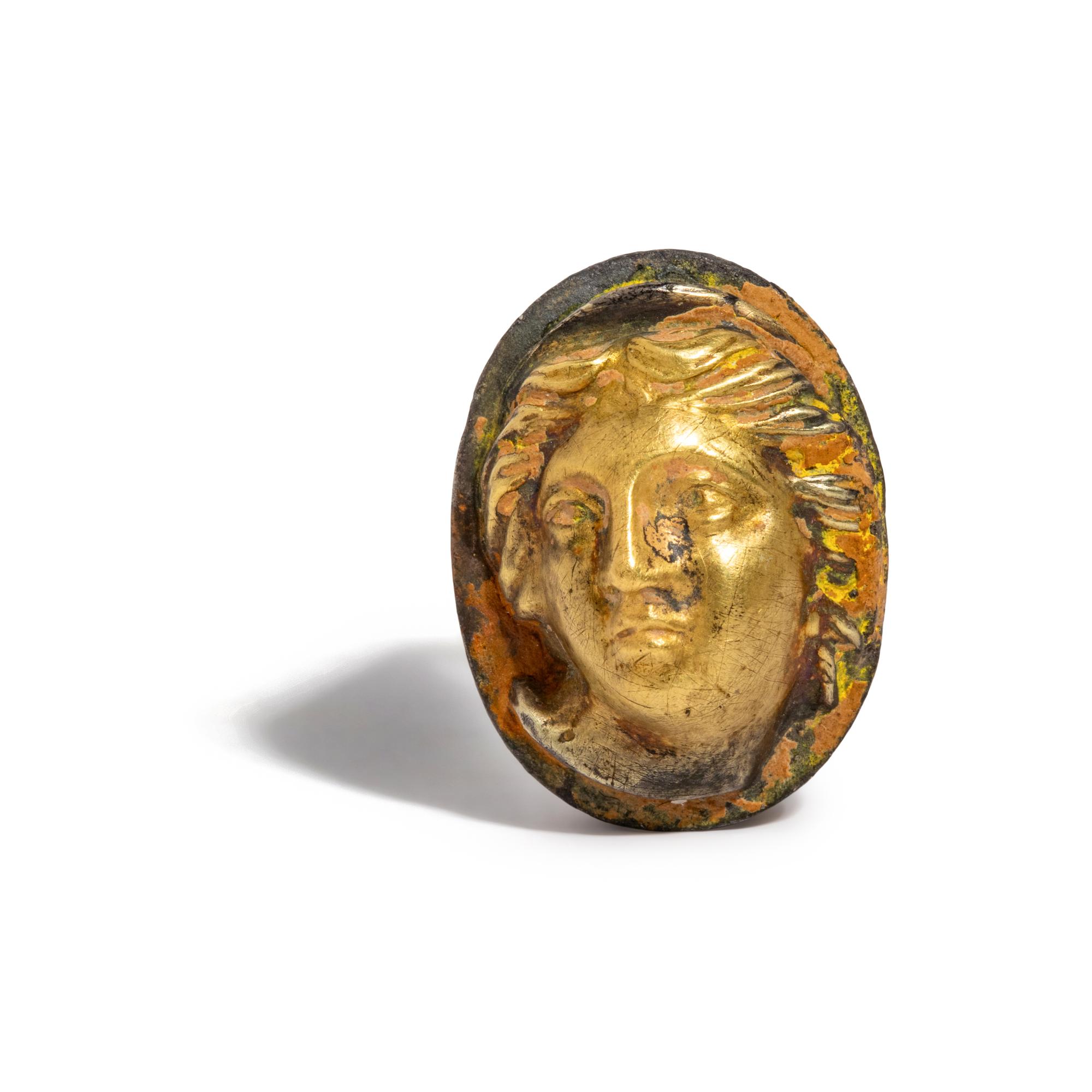A Greek Gilt-Silver Finger Ring with a Female Portrait Head in High Relief