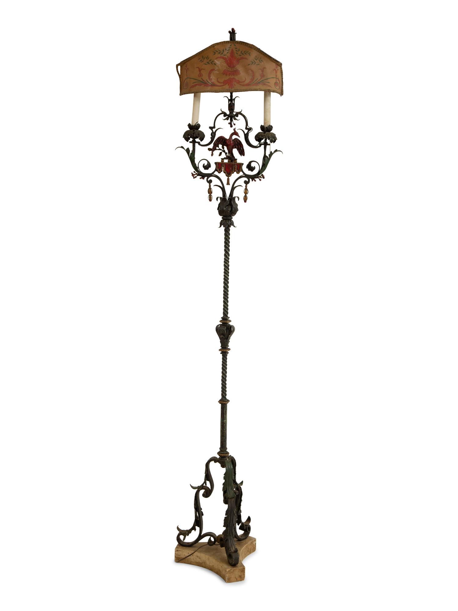 A Mizner Style Painted and Parcel Gilt Wrought Iron Four-Light Torchère with Polychromed Leather Shade