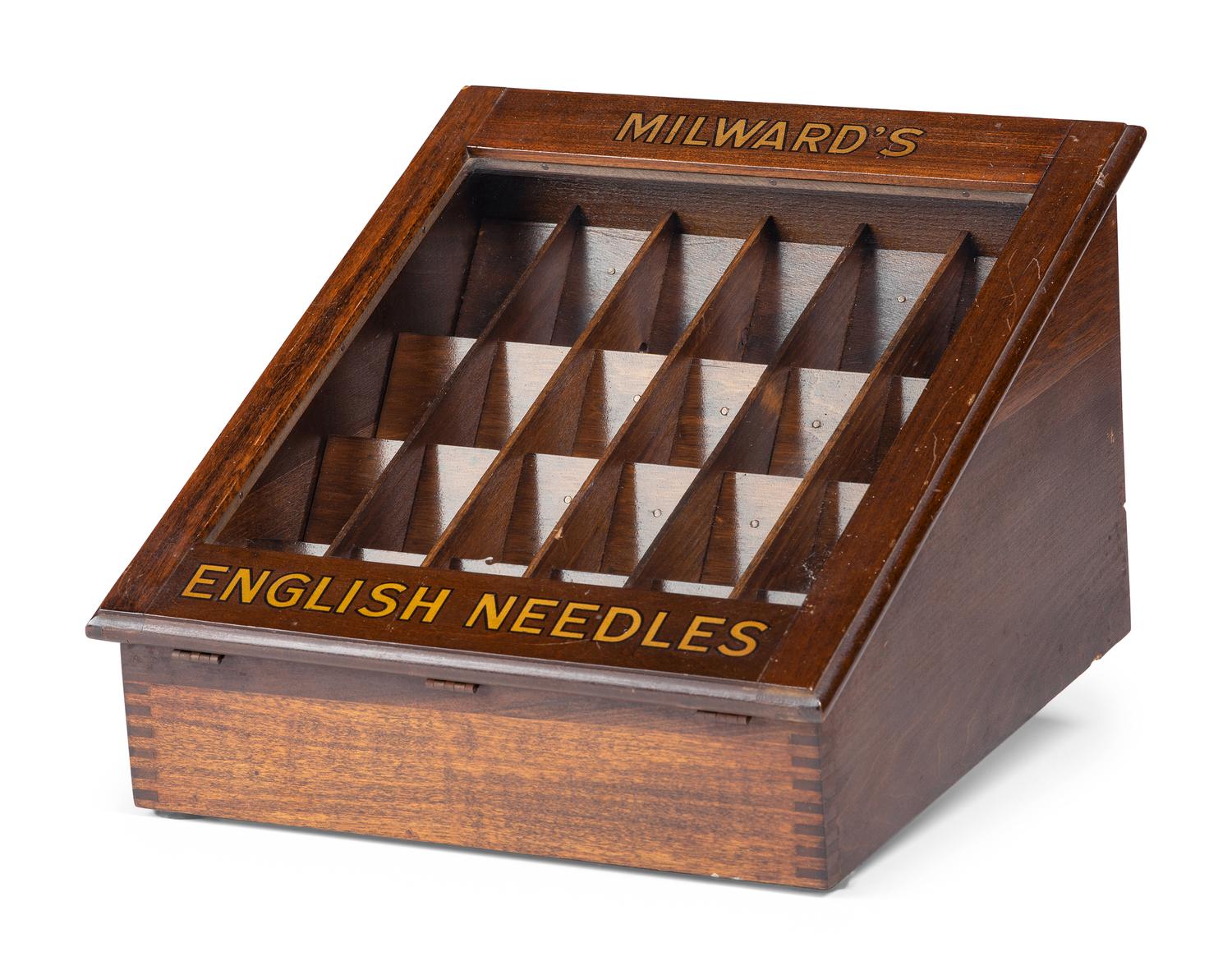 A Milward's English Needles Countertop Display Case