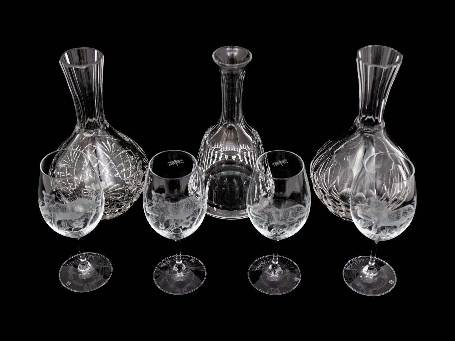 A Set of Four Lynn Chase Wine Glasses with Three Decanters