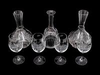 A Set of Four Lynn Chase Wine Glasses with Three Decanters