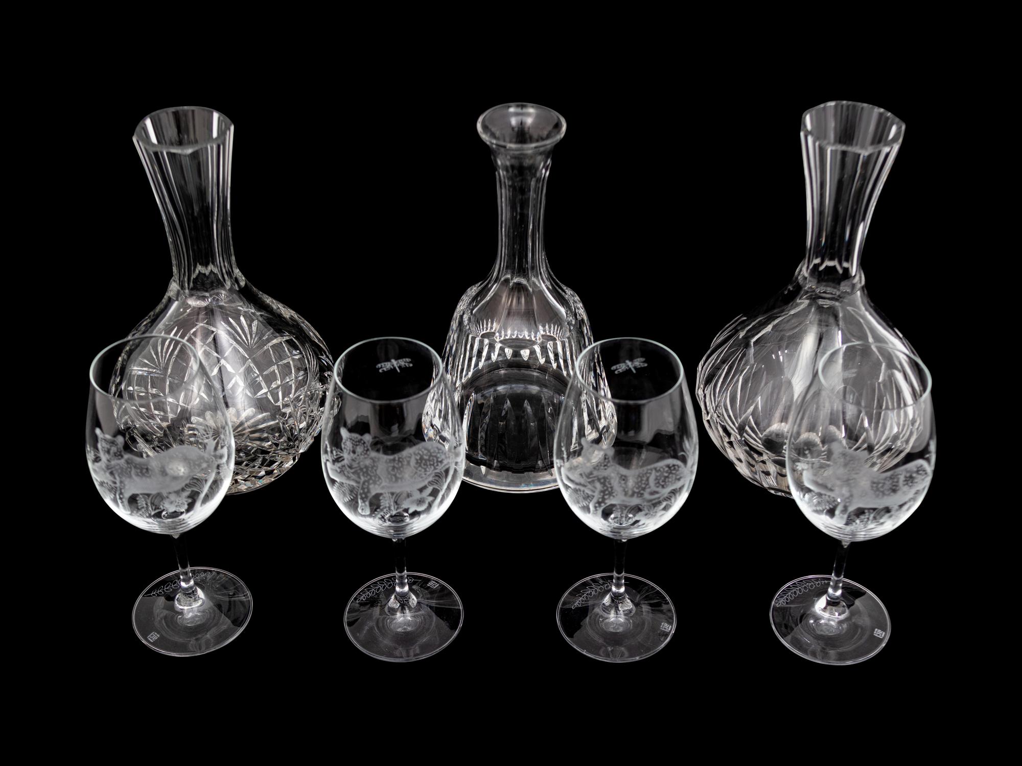 A Set of Four Lynn Chase Wine Glasses with Three Decanters