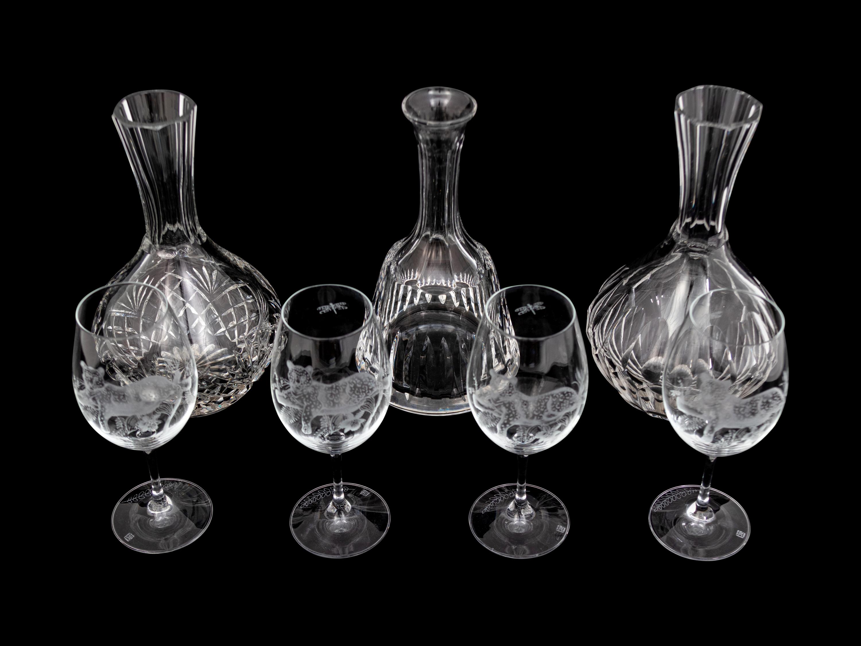 A Set of Four Lynn Chase Wine Glasses with Three Decanters