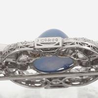 A star sapphire, sapphire, diamond, and platinum brooch, J.E. Caldwell & Co.