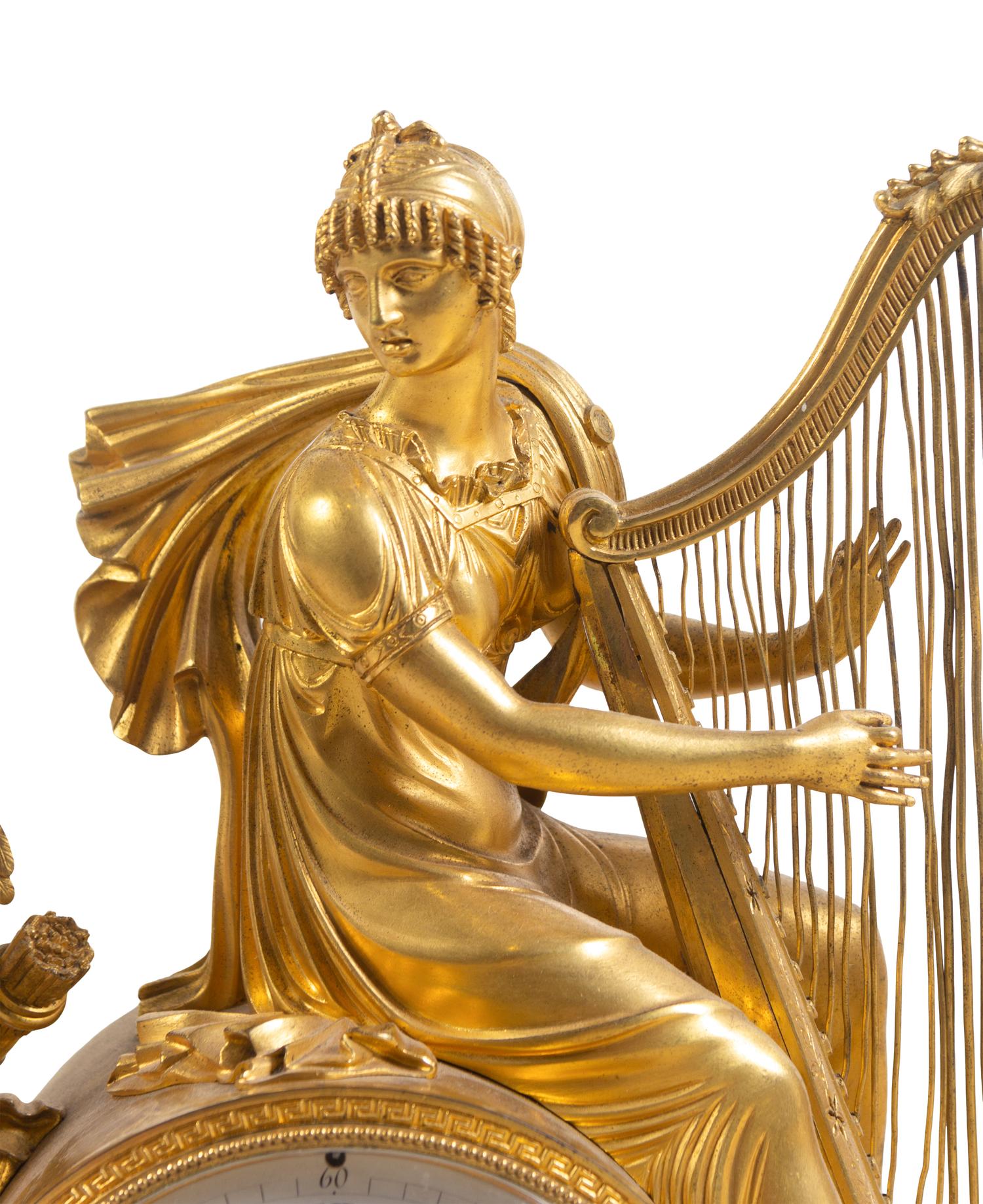 An Empire Gilt Bronze and Marble Figural Mantel Clock